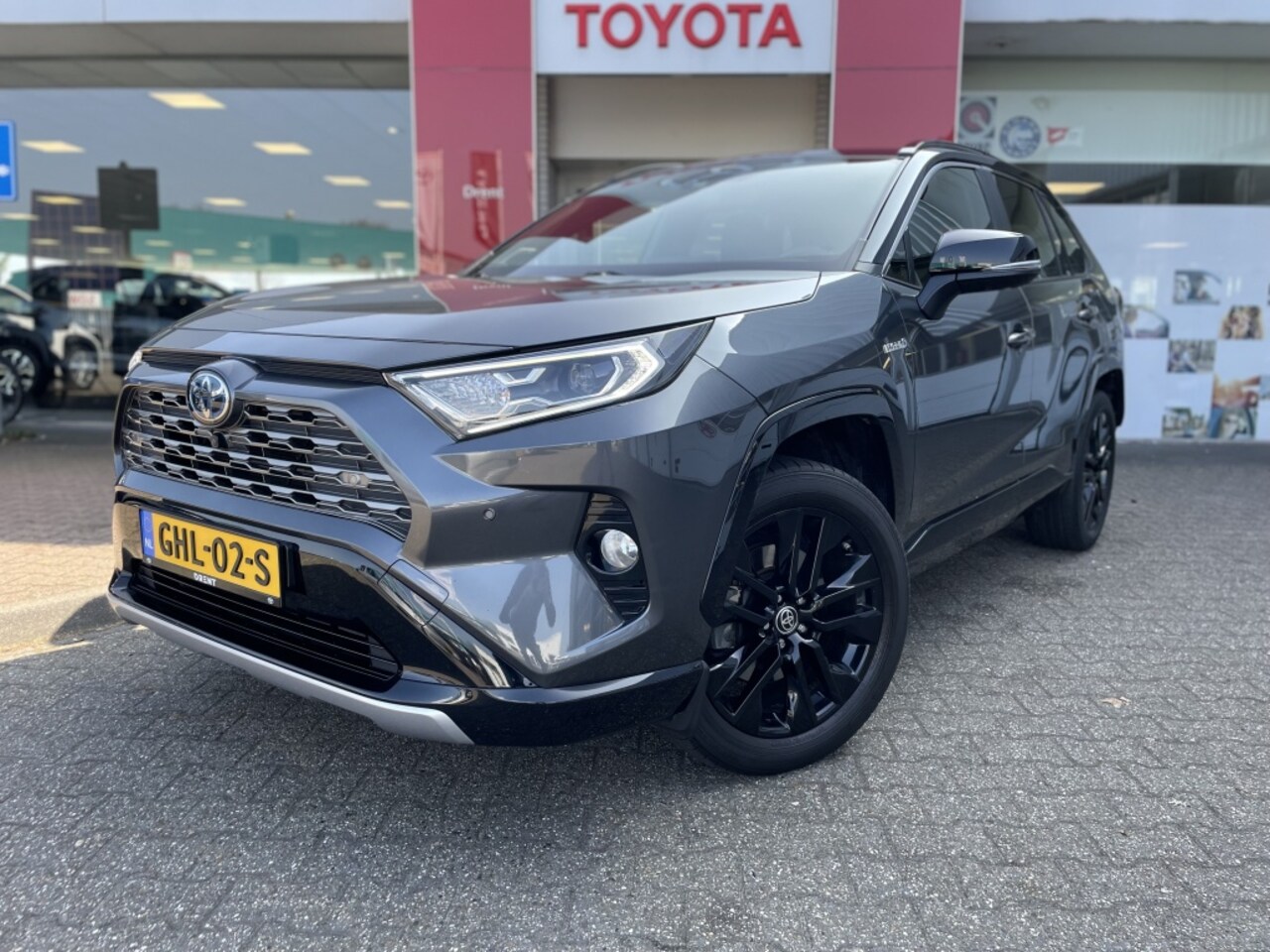 Toyota RAV4 - 2.5 Hybrid Bi-Tone | JBL | Navi | Leder/Alcantara | Se - AutoWereld.nl
