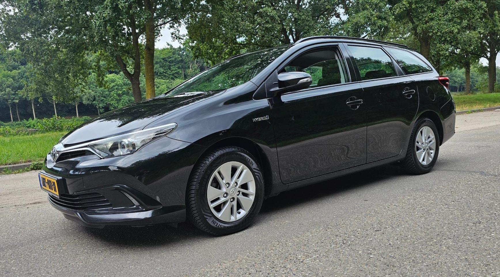 Toyota Auris Touring Sports - 1.8 Hybrid Business 1e Eigenaar - AutoWereld.nl