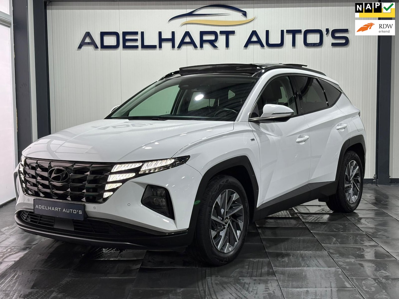 Hyundai Tucson - 1.6 T-GDI MHEV Comfort Smart / Panorama dak / Navigatie full map / Camera / Cruise control - AutoWereld.nl