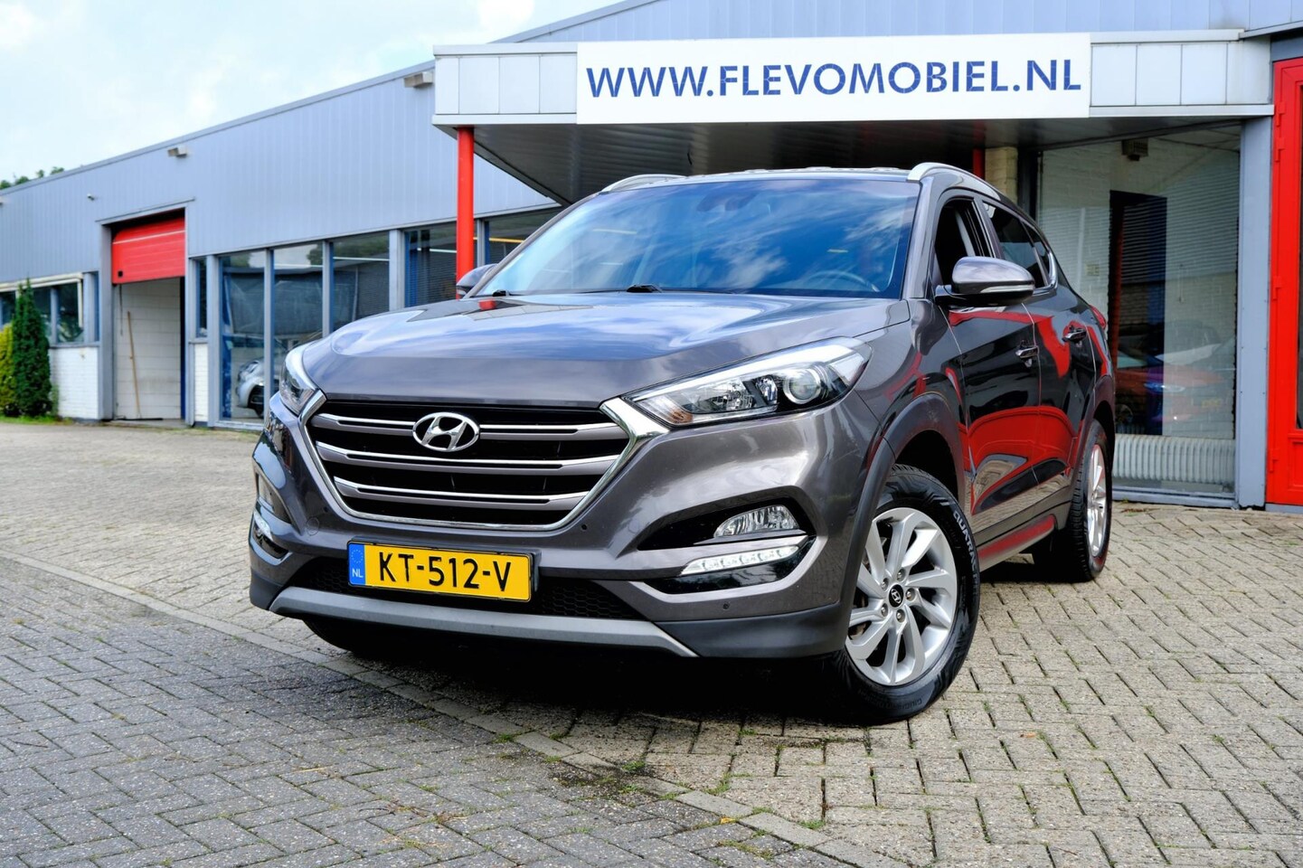 Hyundai Tucson - 1.6 GDi Comfort Navi|Cam|Clima|LMV - AutoWereld.nl