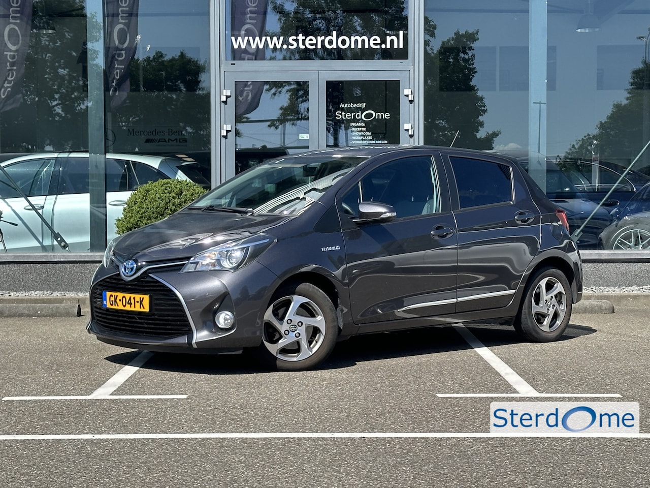 Toyota Yaris - 1.5 Hybrid Lease I Camera I Automaat I Airco l Navigatie I Zeer gunstige KM stand! - AutoWereld.nl