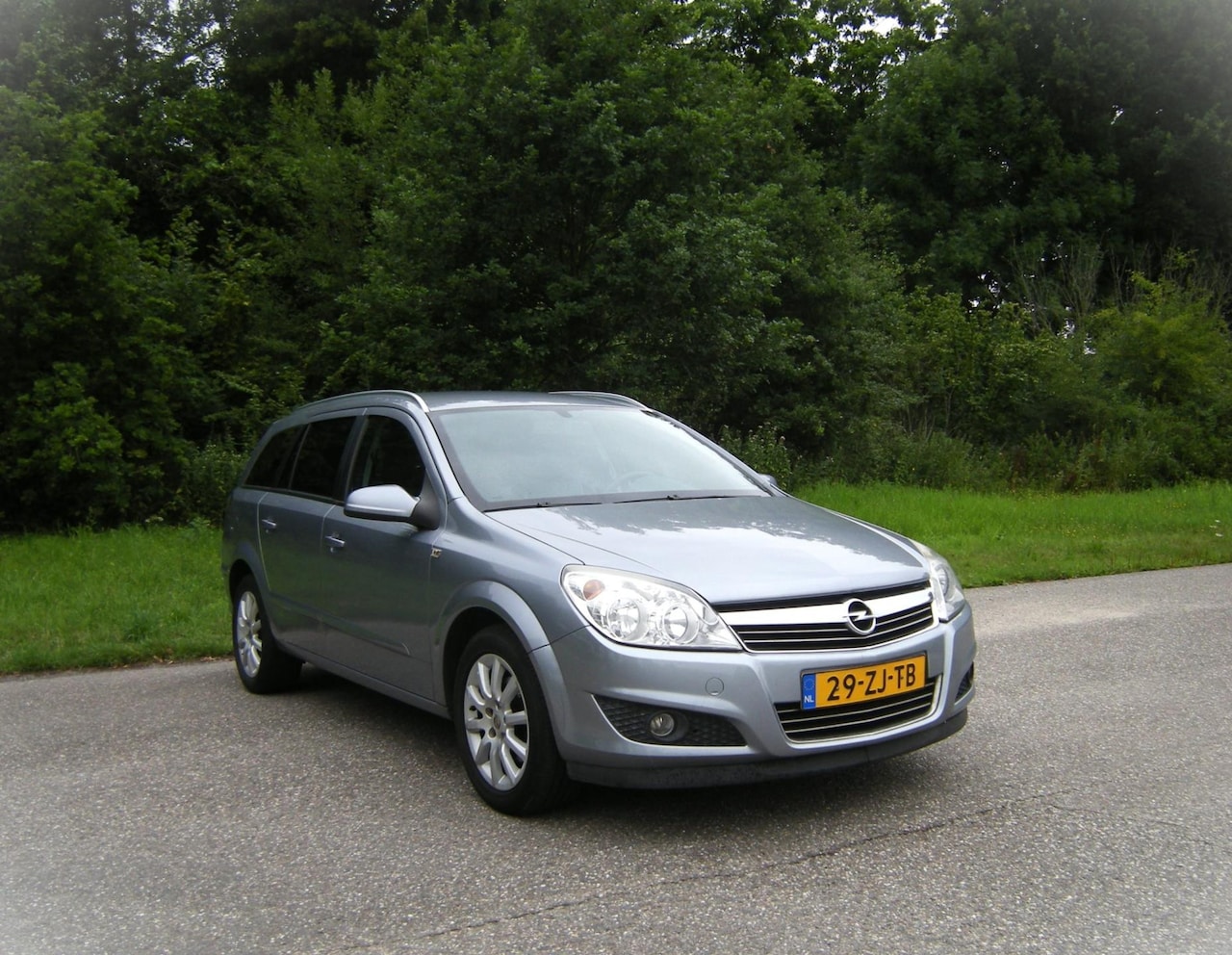 Opel Astra Wagon - 1.6 Cosmo . Navigatie . Cruiscoontrol . Leder intrieur . Stoelverwarming . Trekhaak . enz - AutoWereld.nl