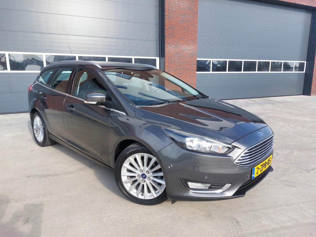 Ford Focus Wagon - 1.0 Titanium Edition Airco/ECC/LMV/NAV - AutoWereld.nl