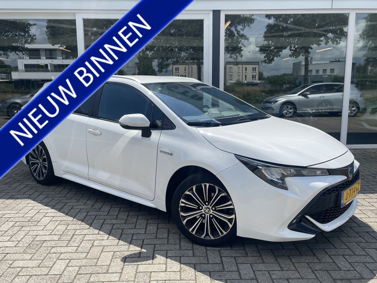 Toyota Corolla Touring Sports - 1.8 Hybrid Business Plus 50% deal 8.975,-  ACTIE Trekhaak / LED / Navi / LMV - AutoWereld.nl