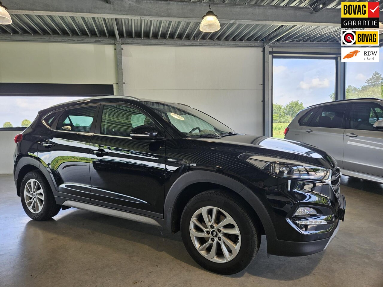 Hyundai Tucson - 1.6 GDi Comfort Navi en camera ! - AutoWereld.nl