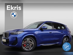 BMW iX1 - eDrive20 67 kWh M Sportpakket Pro/ Stuurwielverwarming/ Comfort Access/ Elektrische Trekha
