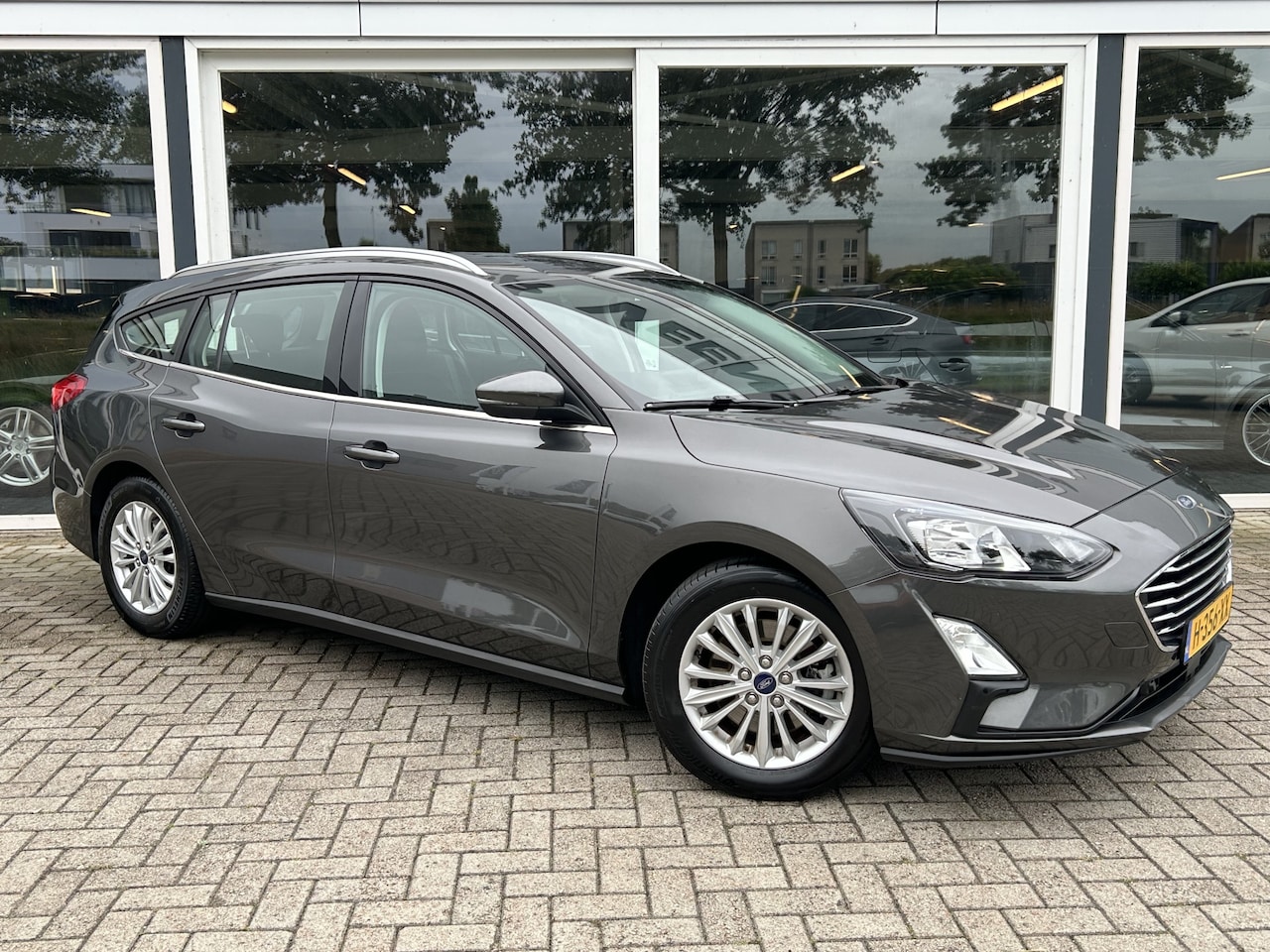 Ford Focus Wagon - 1.0 EcoBoost Titanium Business 50% deal 6.475,- ACTIE Trekhaak / Carplay / Clima / Cruise - AutoWereld.nl
