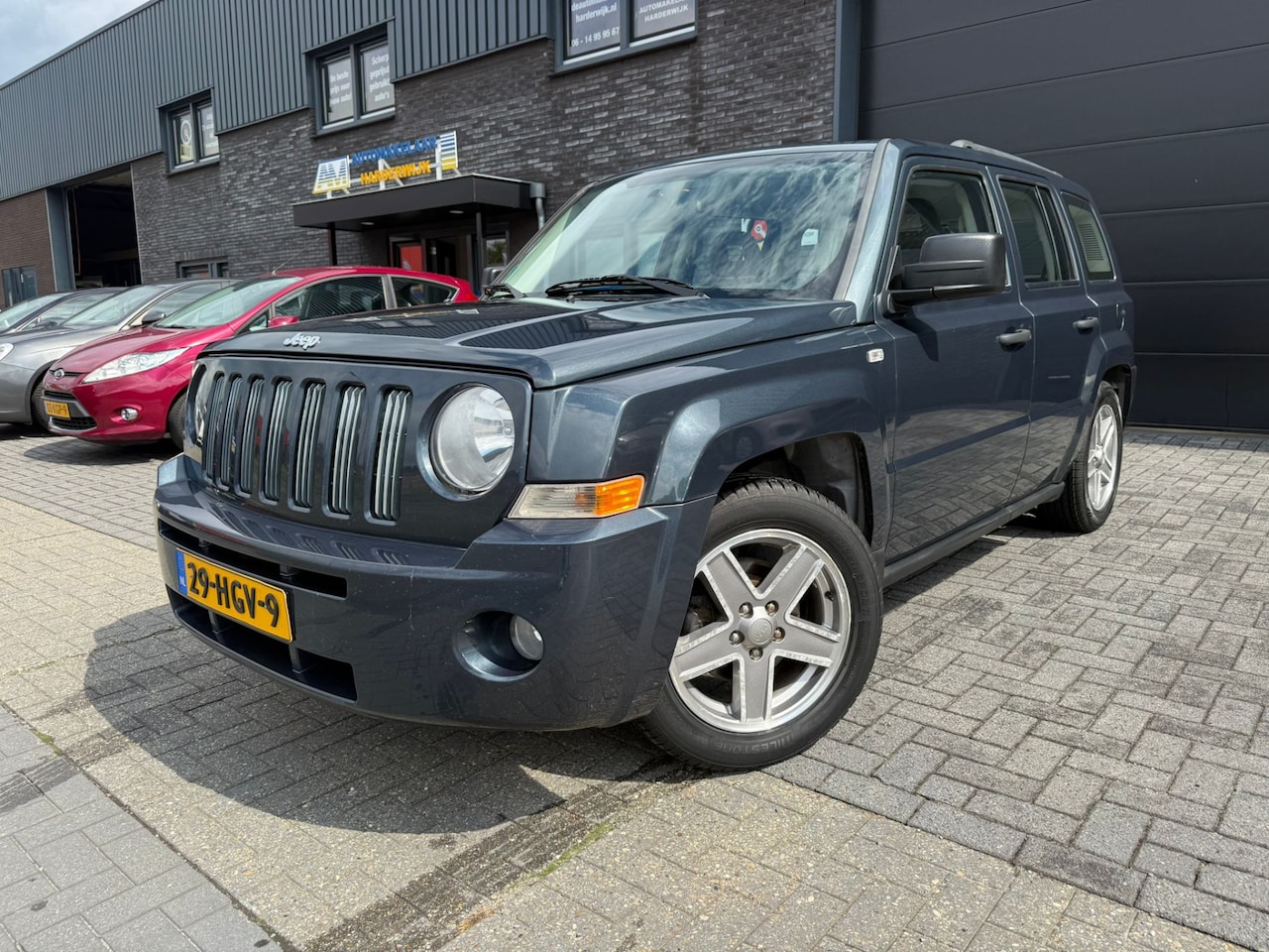 Jeep Patriot - 2.4 Sport Adventure | NIEUWE APK | AIRCO | CRUISE | 4WD | LMV | - AutoWereld.nl