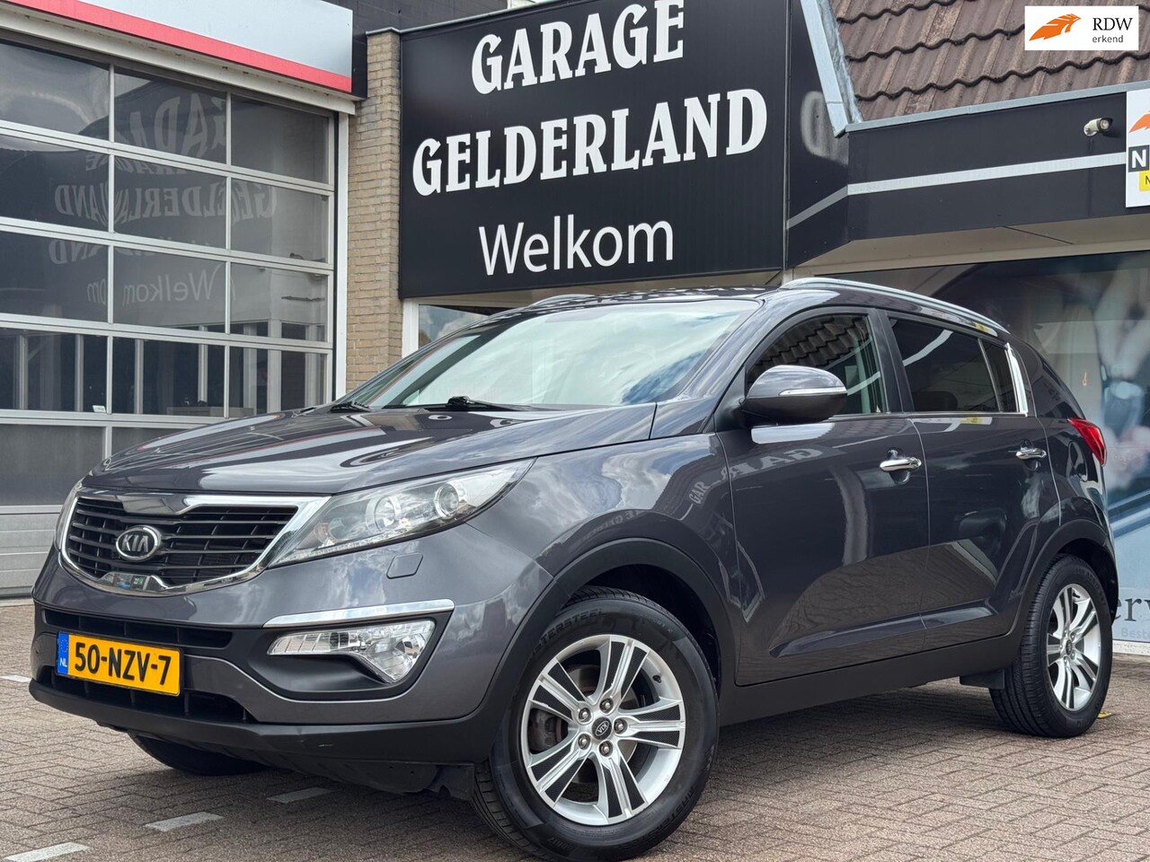 Kia Sportage - 2.0 X-clusive GT | Volleder | Navi | Trekhaak | Cruise | Climate | Full-option! - AutoWereld.nl