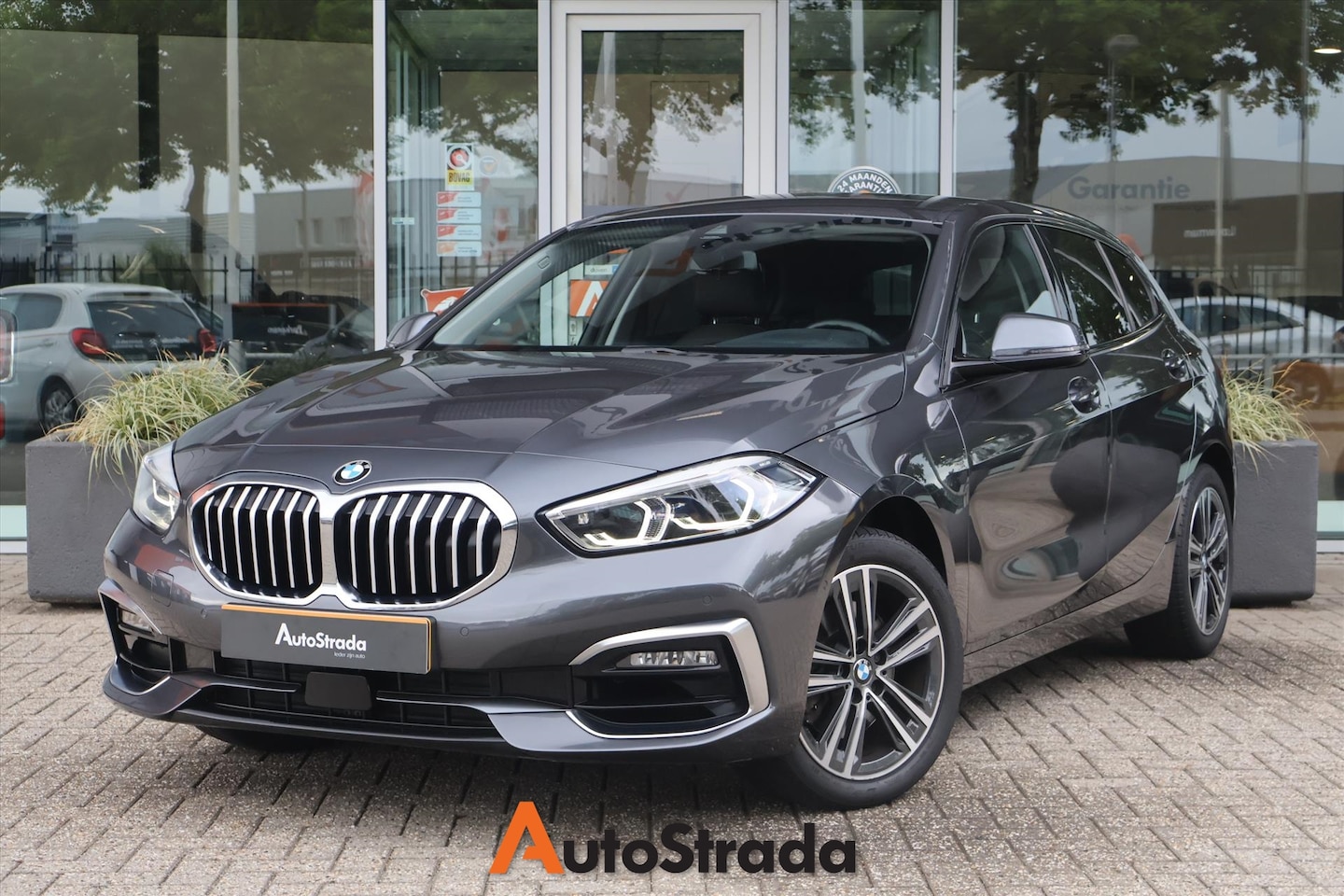 BMW 1-serie - (f40) 116i SportLine | Camera | Navi | Carplay | Cruise | Sfeer | LED | Climate | Leder - AutoWereld.nl