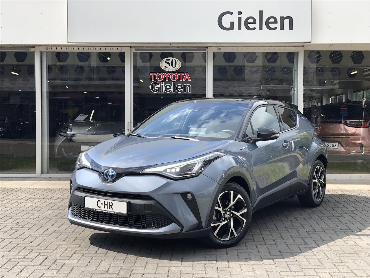 Toyota C-HR - 2.0 Hybrid 184pk Bi-Tone | Dodehoekherkenning, Stoel + Stuurverwarming, Parkeersensoren, A - AutoWereld.nl