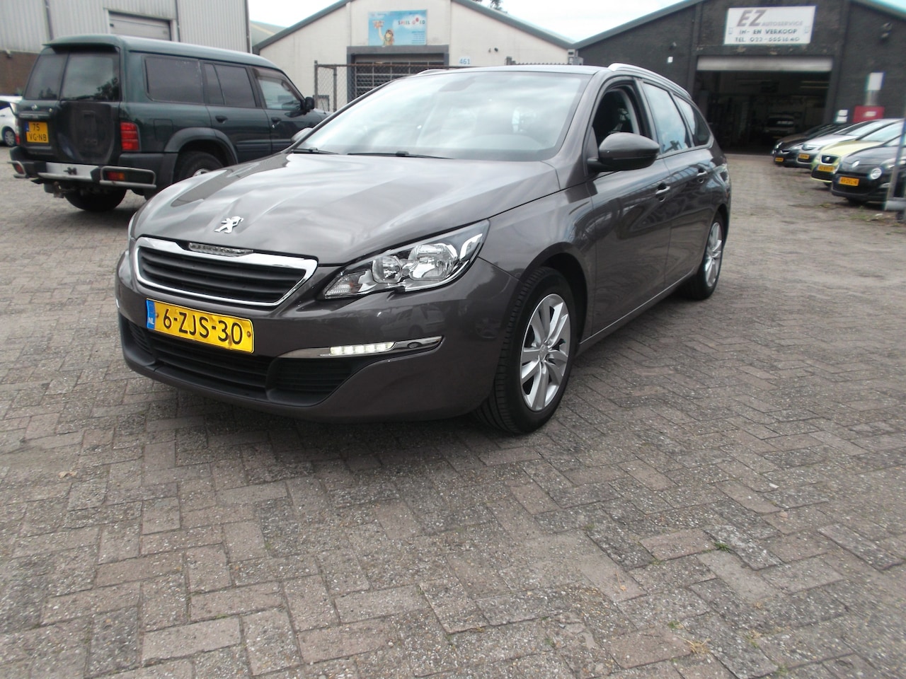 Peugeot 308 SW - 1.2 e-THP Allure navi airco pano dak - AutoWereld.nl