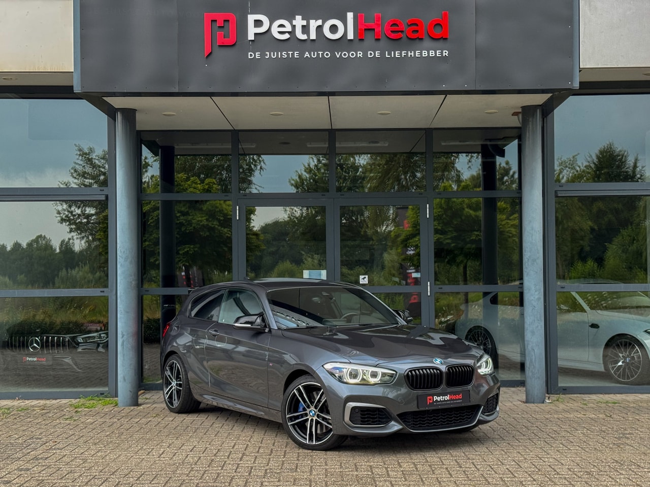 BMW 1-serie - M140i High Executive M140i High Executive, Lci 2, H&K, Camera, CarPlay, Lane-assist - AutoWereld.nl