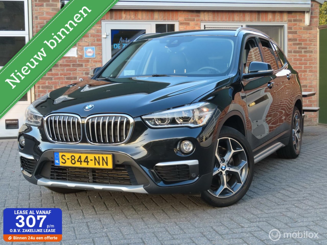BMW X1 - xDrive20i High Executive|camera|afneembare trekhaak|stoelverwarming. - AutoWereld.nl