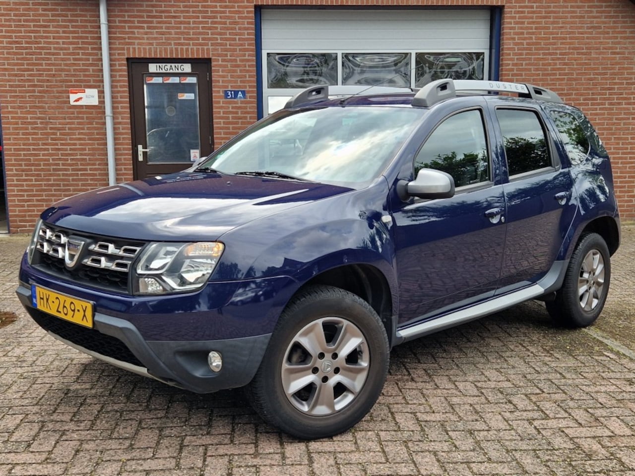 Dacia Duster - 1.2 TCe 4x2 Prestige NL-auto Airco Leer Navi Trekhaak - AutoWereld.nl