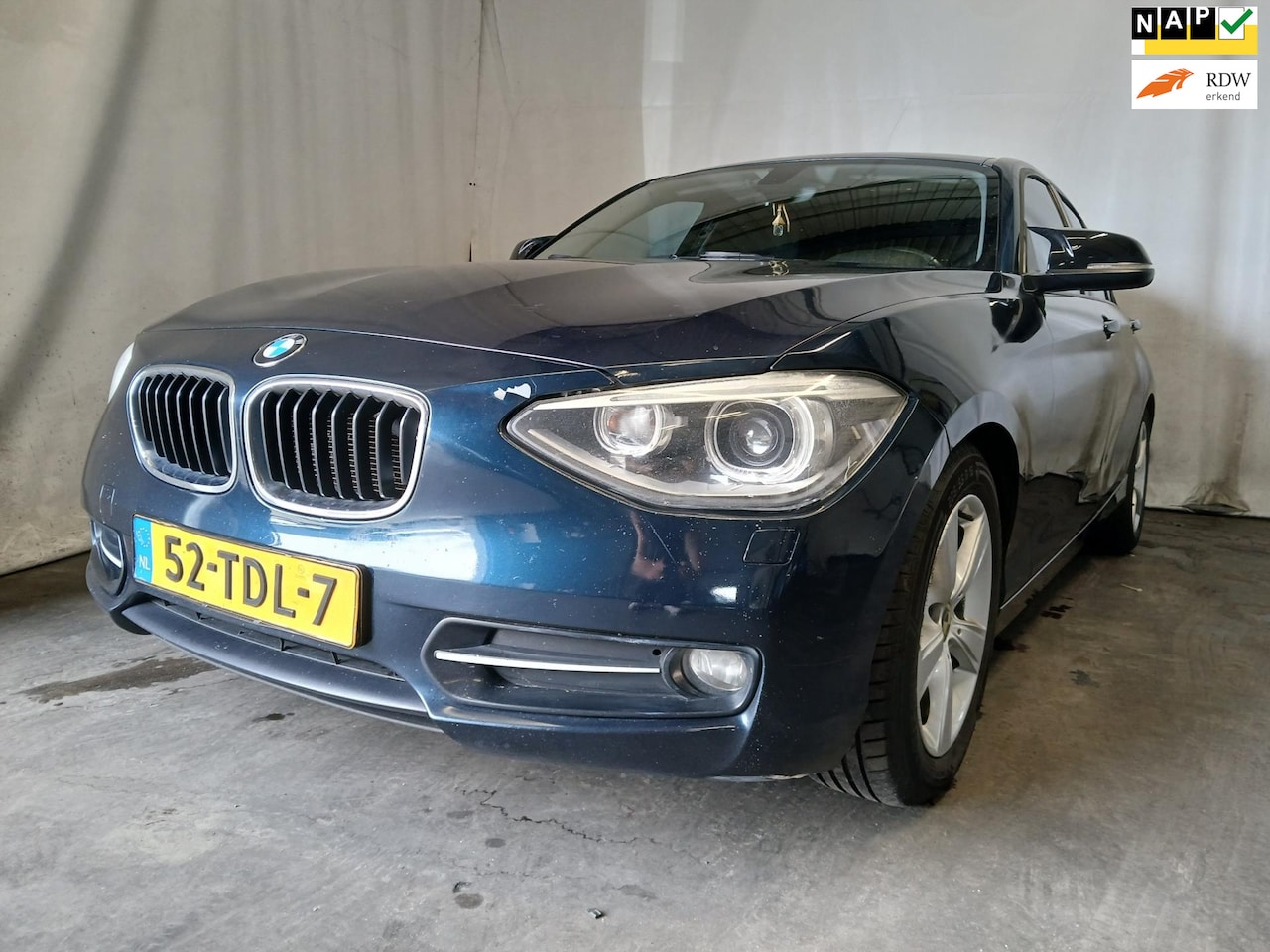BMW 1-serie - 116i Business+ - Airco - Navi - Motor loopt onregelmatig - AutoWereld.nl