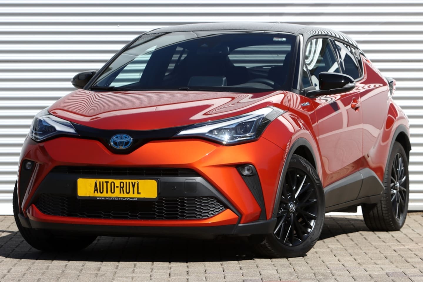 Toyota C-HR - 2.0 Hybrid Style Luxury Orange Edit. - AutoWereld.nl