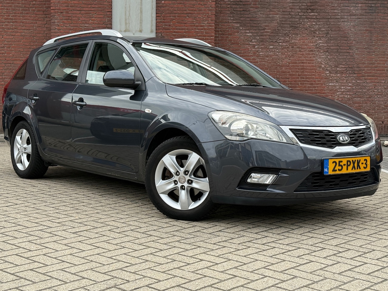 Kia Cee'd Sporty Wagon - 1.4 CVVT Seven|AIRCO|NAVI|R.CAMARA|CRUISE|TREKHAAK - AutoWereld.nl