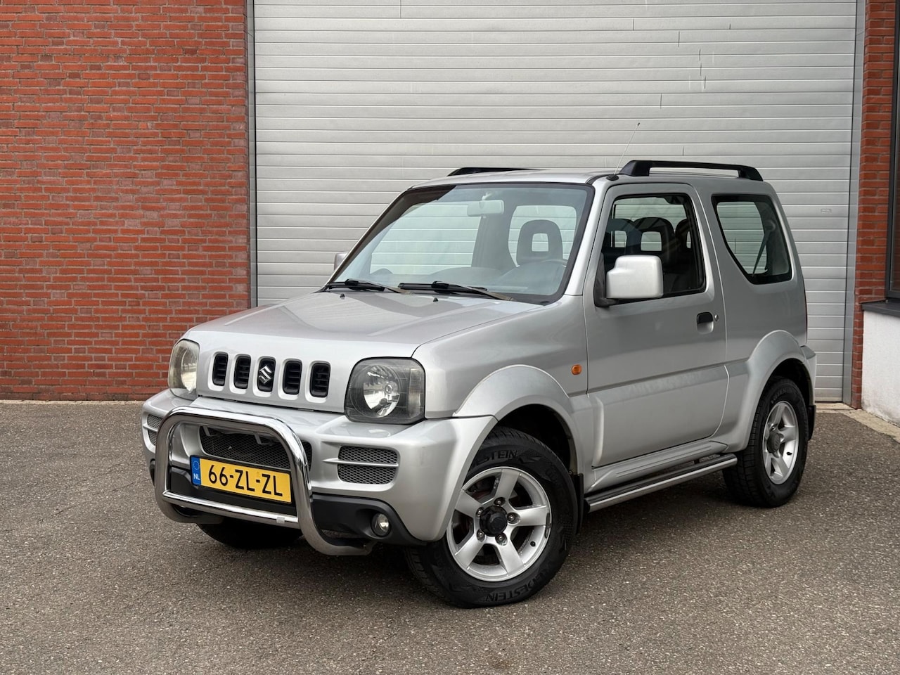 Suzuki Jimny - 1.3 Exclusive| AUTOMAAT| AIRCO| 4WD| TREKHAAK - AutoWereld.nl