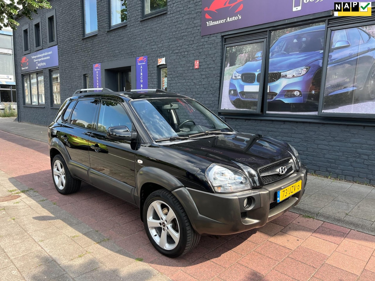 Hyundai Tucson - 2.0i Style airco navi - AutoWereld.nl