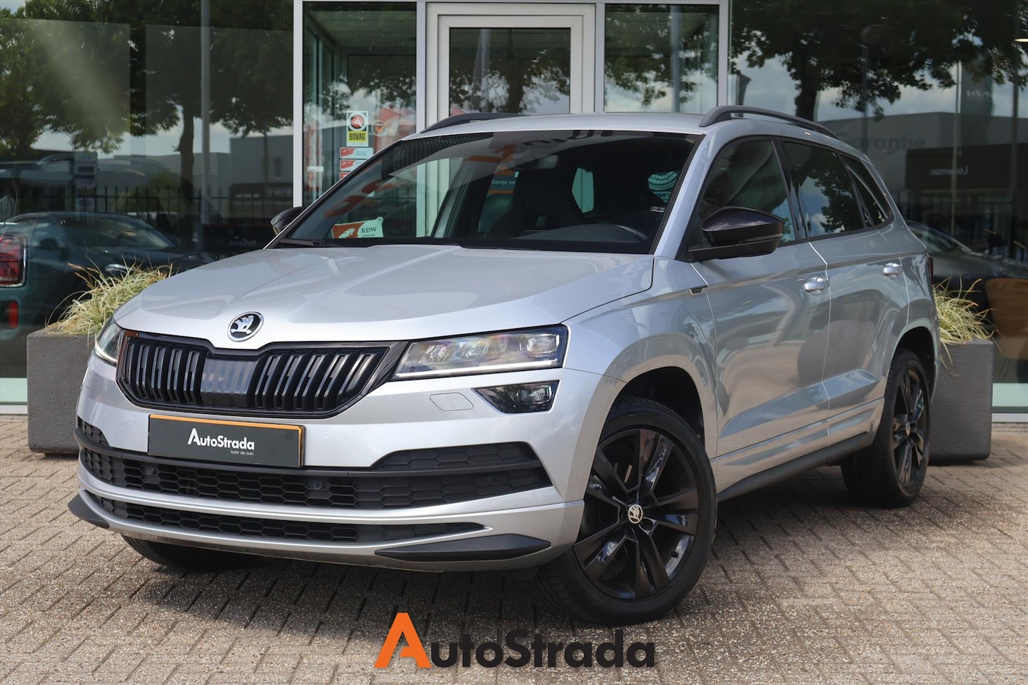 Skoda Karoq - 1.5 SportLine TSI ACT 150pk | Canton | Camera | LED | Navi | Cruise | Climate | Carplay | - AutoWereld.nl