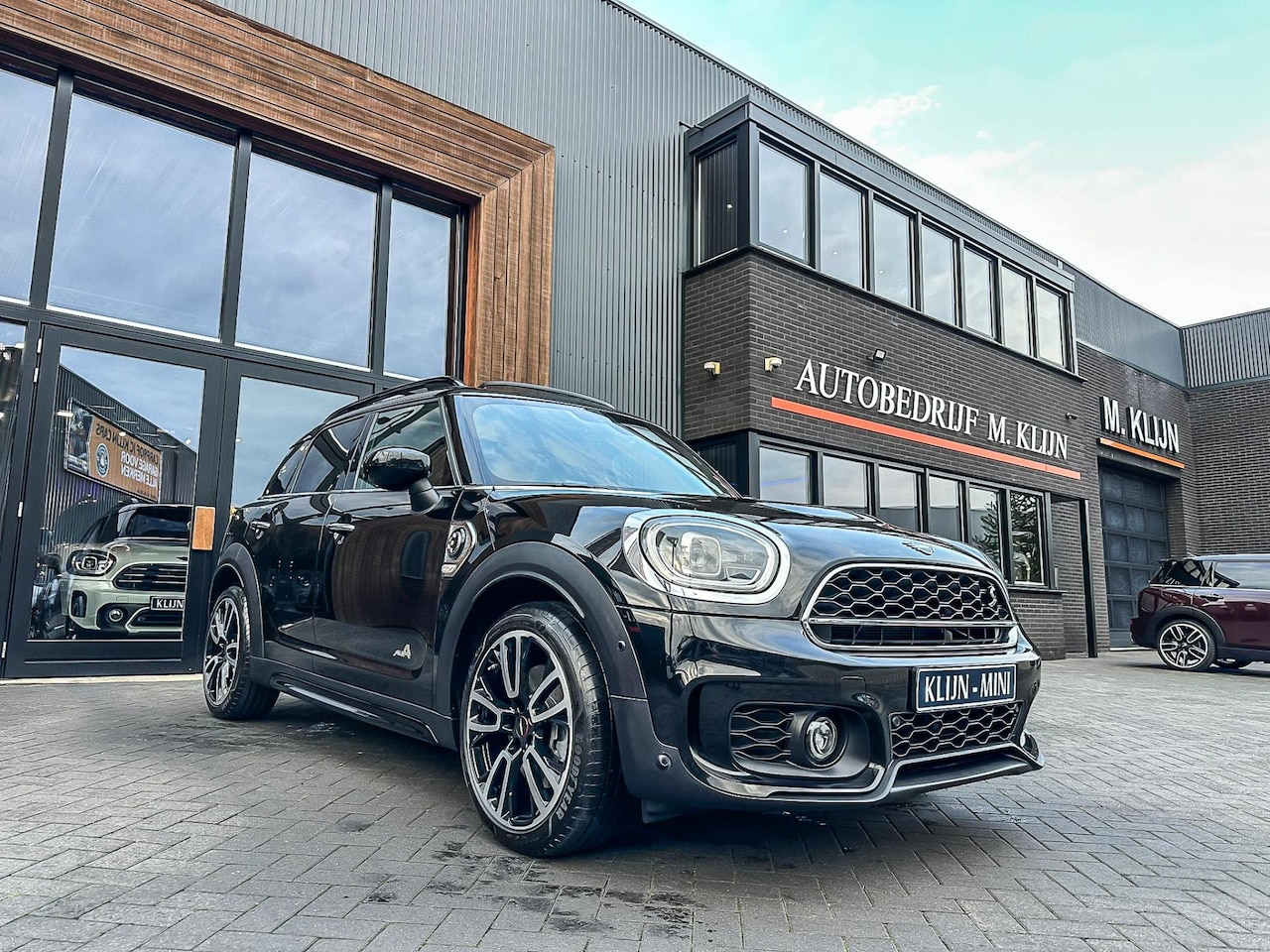 MINI Countryman - Mini 2.0 Cooper S E ALL4 John Cooper Works Aut 220pk/Pano/Camera/Jcw stoelen/Facelift - AutoWereld.nl