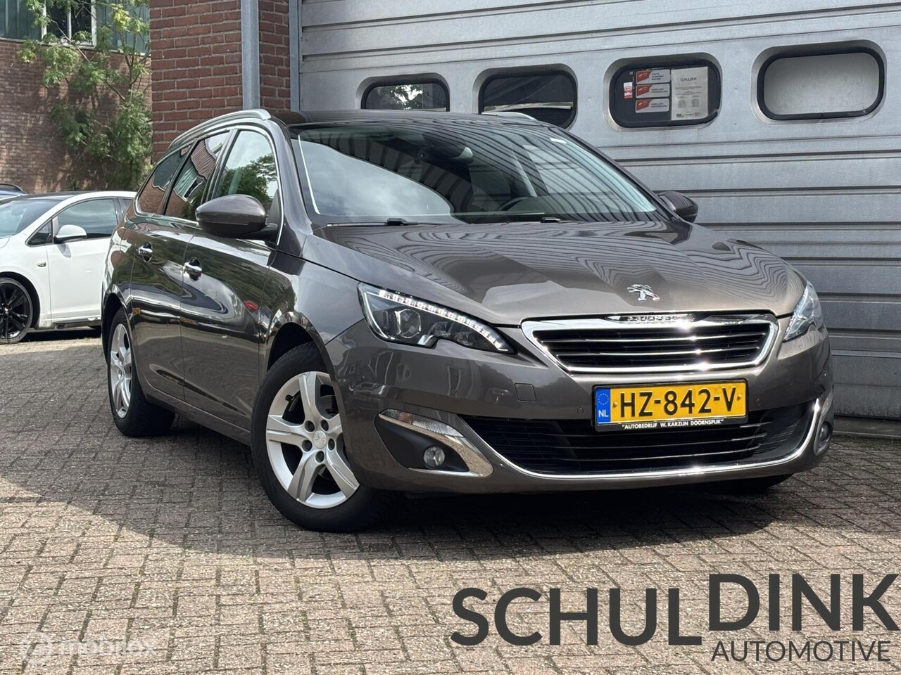 Peugeot 308 SW - 1.2 pt PANORAMADAK|TREKHAAK|CRUISE CONTROLE - AutoWereld.nl