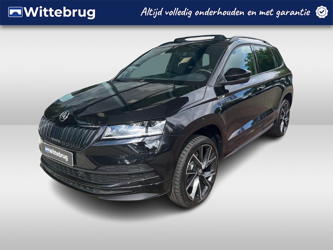 Skoda Karoq - 1.5 TSI ACT Sportline Business / Panorama dak / Adaptieve cruise control / Elektrische ach - AutoWereld.nl