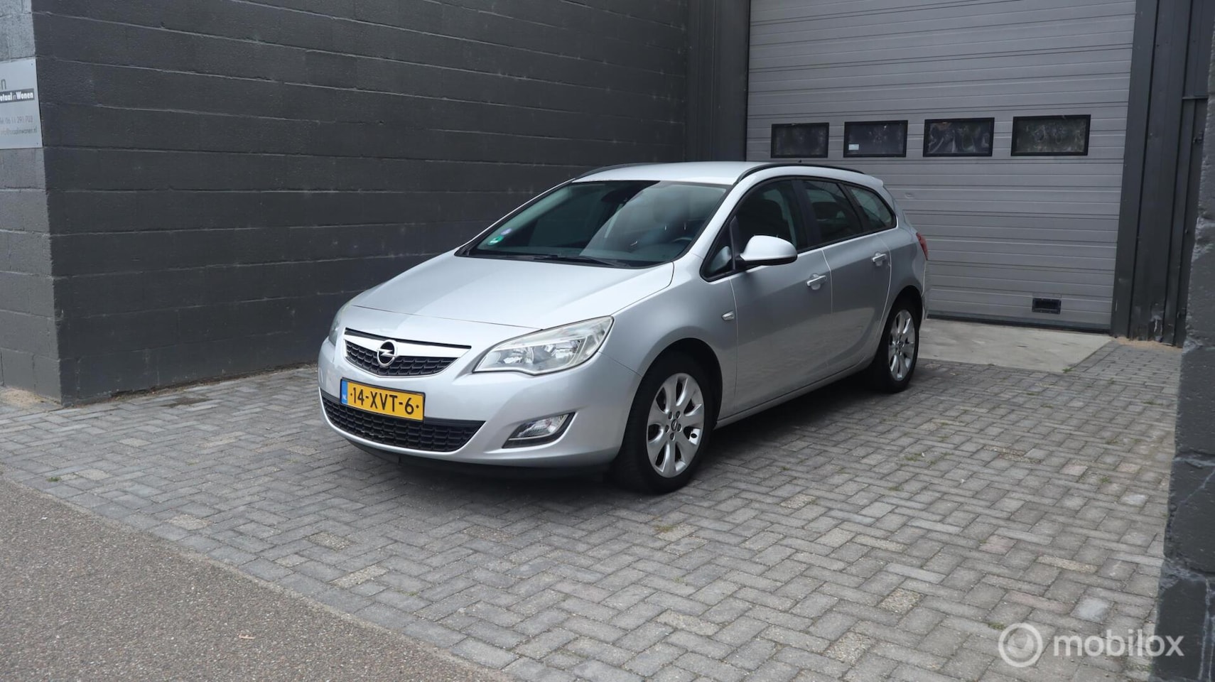 Opel Astra Sports Tourer - 1.4 Cosmo | AIRCO | Trekhaak | All-season banden | - AutoWereld.nl