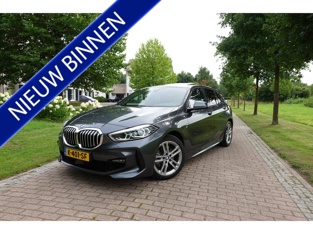 BMW 1-serie - 118i High Executive M-Sport | Panodak | Stoelverw. | LED | DAB | Camera | - AutoWereld.nl