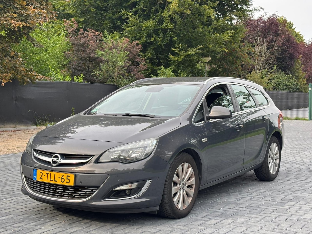 Opel Astra Sports Tourer - 1.7 CDTi Cosmo/Clima/Cruise/Navi/PDC/LMV/NAP - AutoWereld.nl