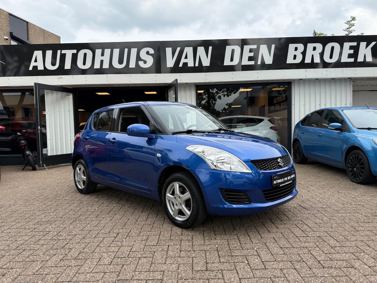 Suzuki Swift - 1.2 4X4 5Deurs|1e Eigenaar|Ac|Clima|Stoelverw|Keyless|Lmv|Elek Pakket|Nw Apk - AutoWereld.nl