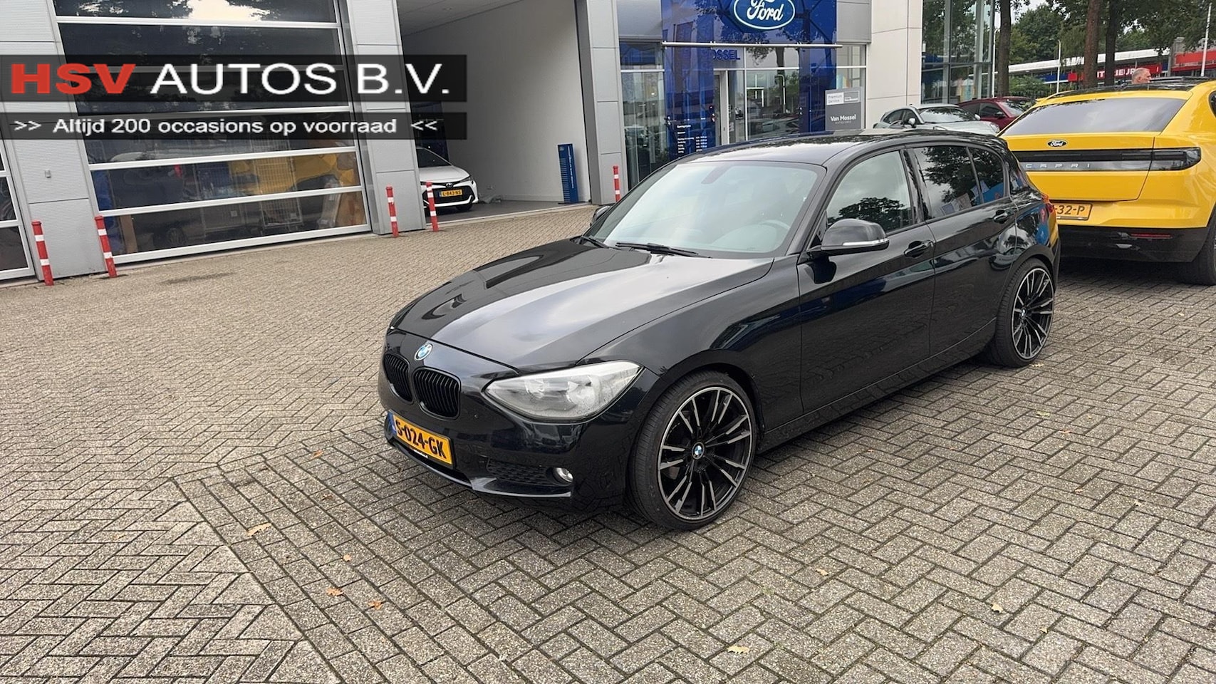 BMW 1-serie - 116i Business airco LM navi 4-deurs - AutoWereld.nl
