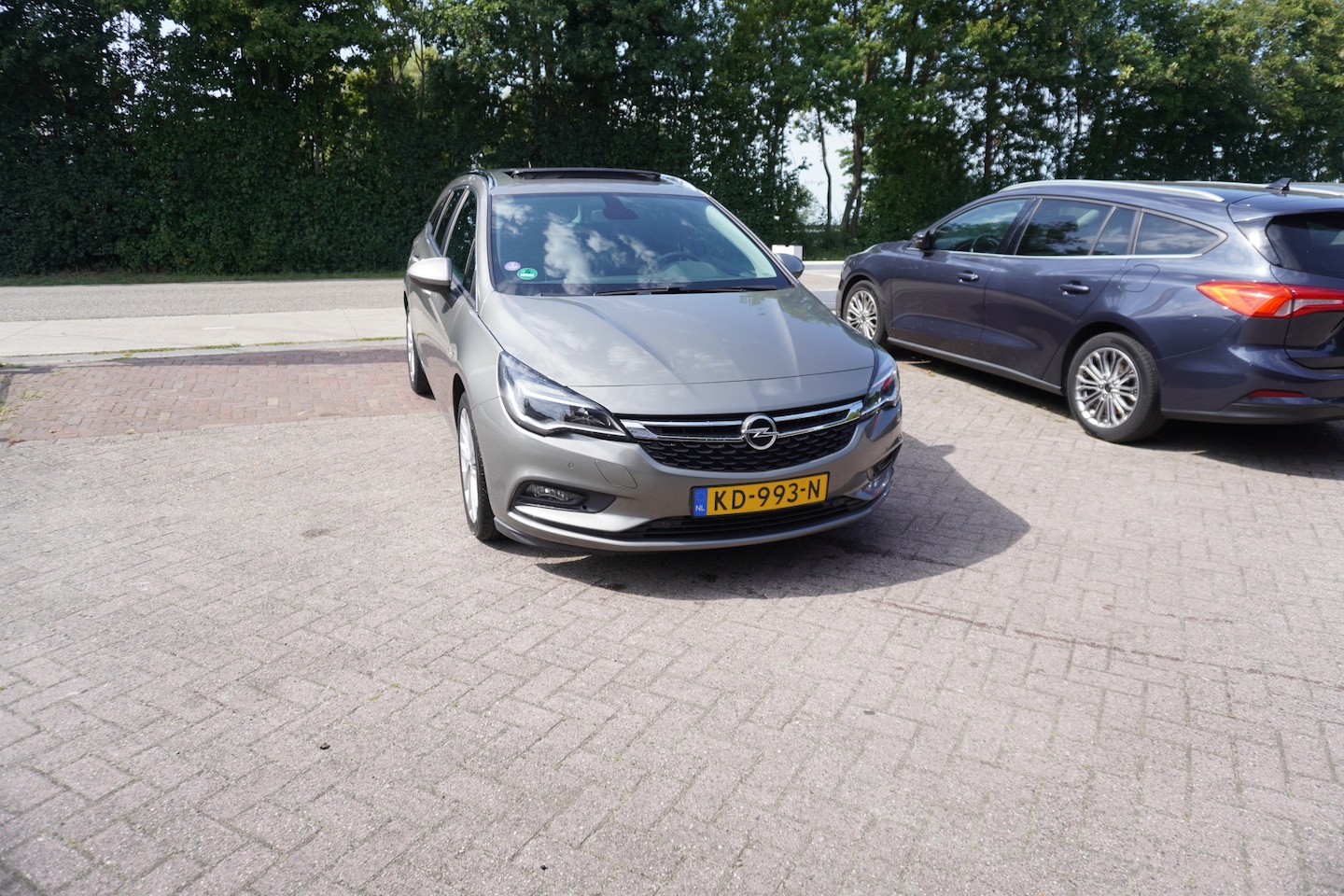 Opel Astra Sports Tourer - 1.0 Business+ TREKHAAK OPEN DAK NAVI PDC - AutoWereld.nl