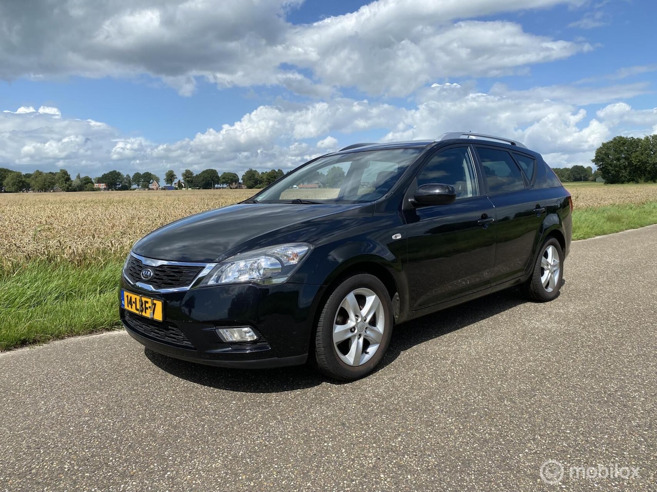 Kia Cee'd Sporty Wagon - 1.4 CVVT Seven Airco Navi Cruise - AutoWereld.nl