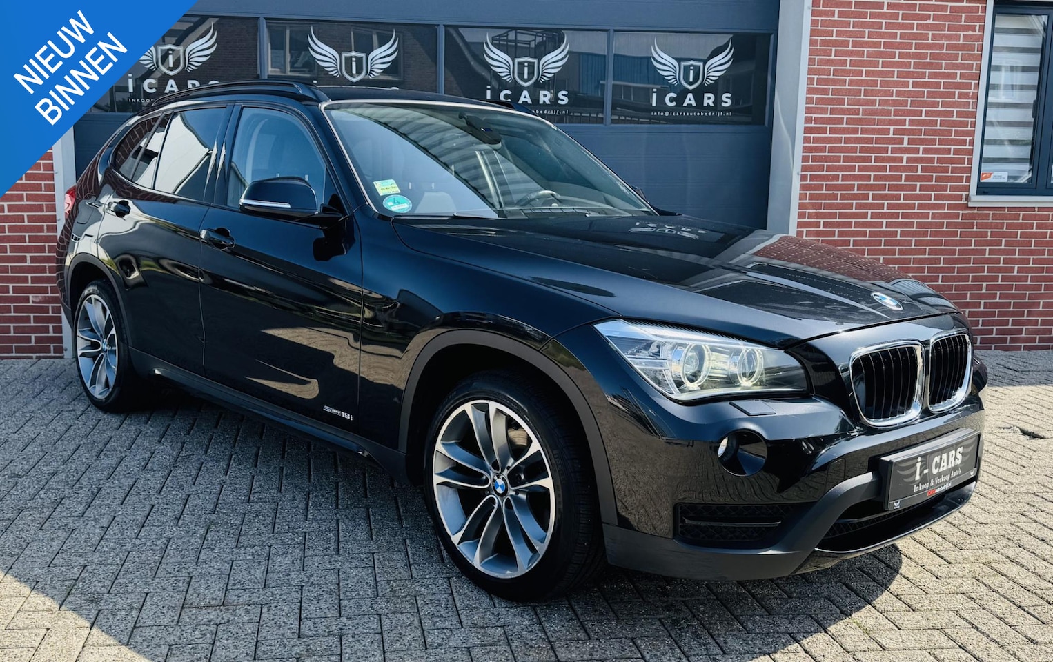 BMW X1 - sDrive18i Sportline NAVI PDC - AutoWereld.nl