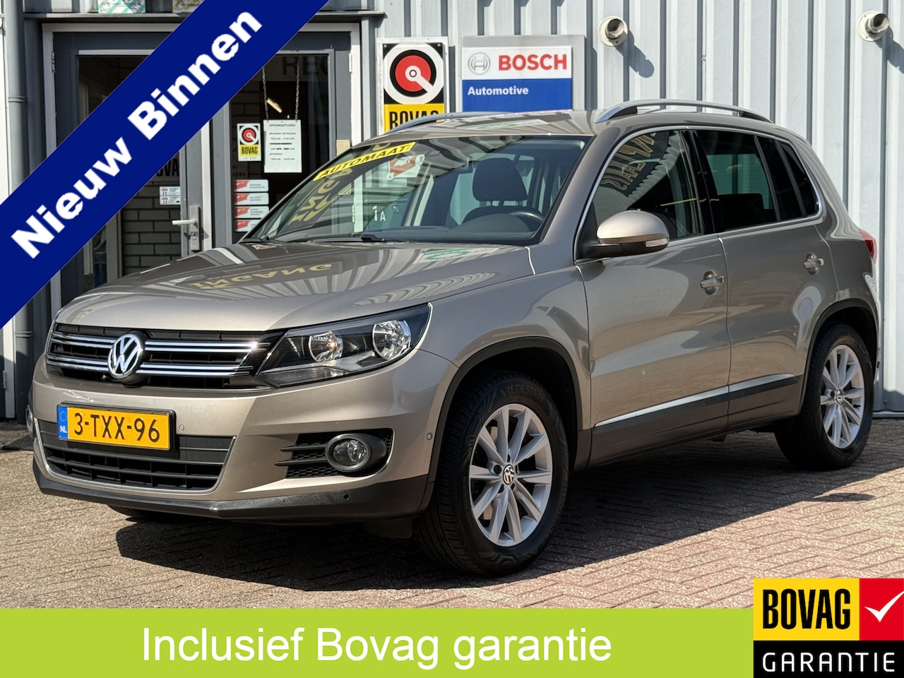 Volkswagen Tiguan - 1.4 TSI Sport&Style | AUTOMAAT | TREKHAAK | CAMERA | NAVI | CRUISE | - AutoWereld.nl