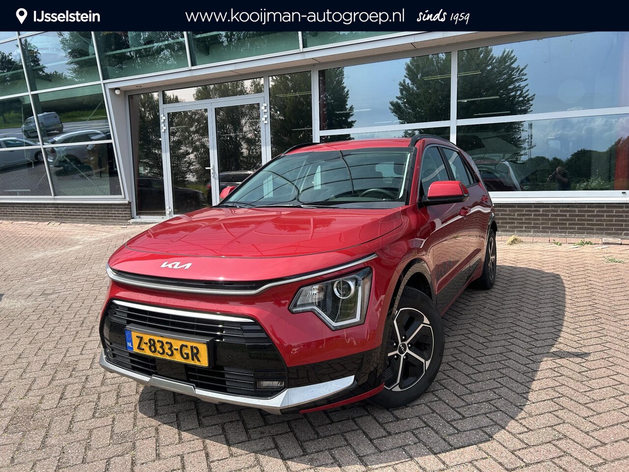 Kia Niro - 1.6 GDi Hybrid DynamicLine Direct leverbaar | Runway Red | Foto's volgen - AutoWereld.nl