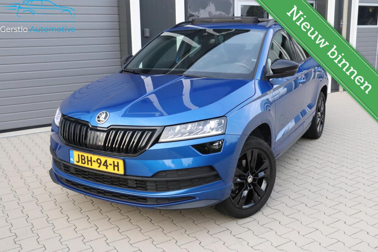 Skoda Karoq - 1.5 TSI Sportline Pano ACC Elec kofferklep 18" - AutoWereld.nl