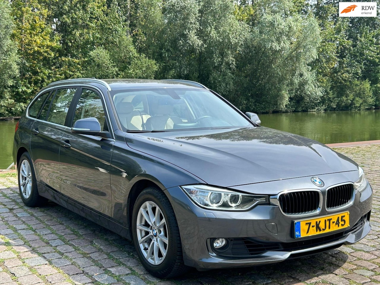 BMW 3-serie Touring - 320i High Executive 2e eigenaar dealer onderhouden navigatie leerbekeleding stoelverwarmin - AutoWereld.nl