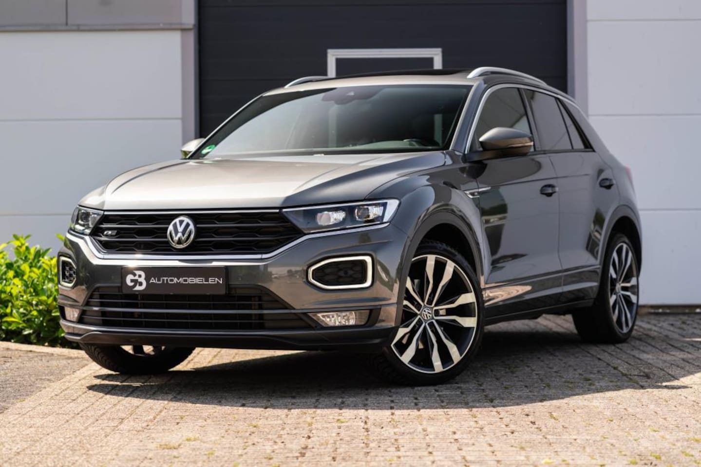 Volkswagen T-Roc - 1.5 TSI Sport Business 3xR-Line PANO - AutoWereld.nl