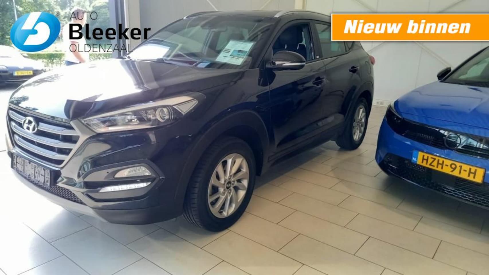 Hyundai Tucson - 1.6 GDI Passion Airco Trekhaak Navi Carplay - AutoWereld.nl