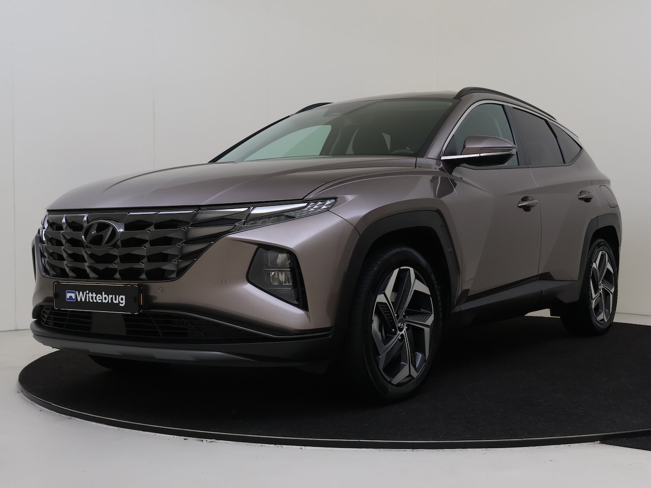 Hyundai Tucson - 1.6 T-GDI PHEV 265pk Comfort Smart 4WD | Navigatie | Parkeercamera | Elektrische Achterkle - AutoWereld.nl