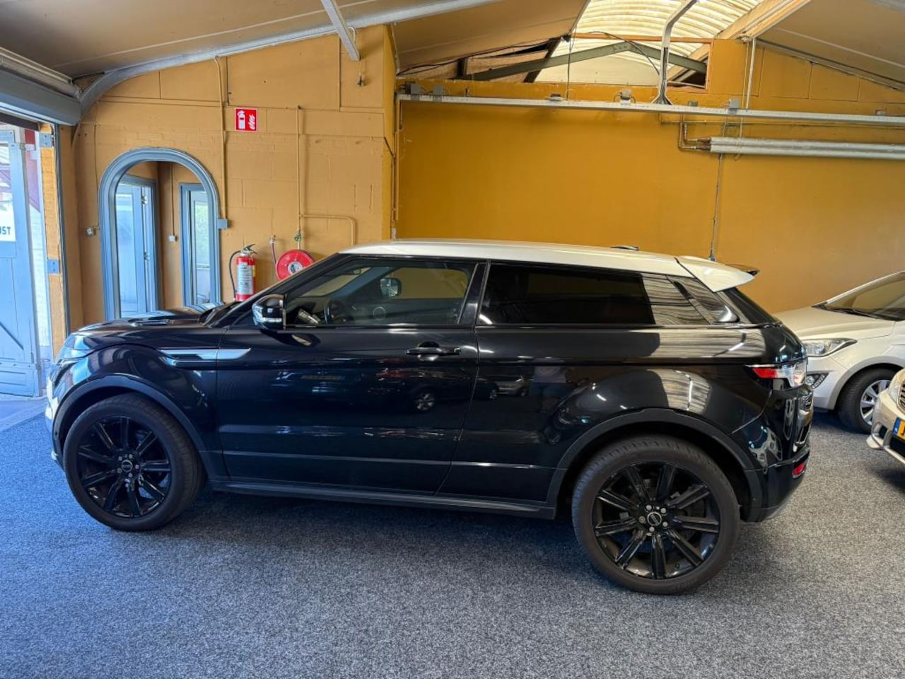 Land Rover Range Rover Evoque Coupé - 2.2 SD4 4WD Prestige 2.2 SD4 4WD Prestige - AutoWereld.nl