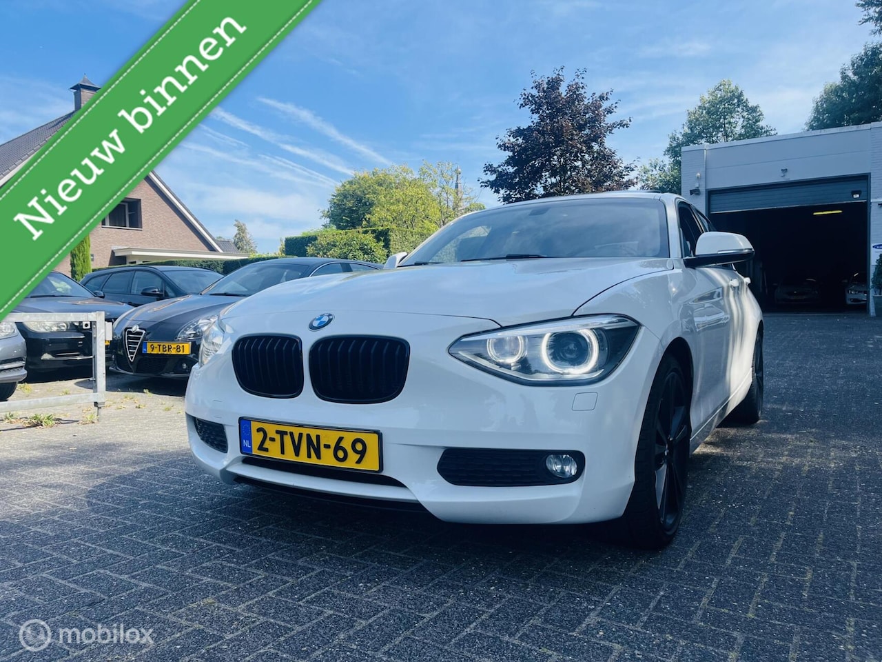 BMW 1-serie - 116d High Executive Sport / Leder / Dak / PDC / Navi - AutoWereld.nl