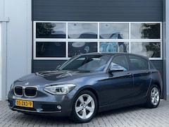 BMW 1-serie - 116i Upgrade Edition | Leder | Xenon | Navi | PDC | Cruise control | Trekhaak