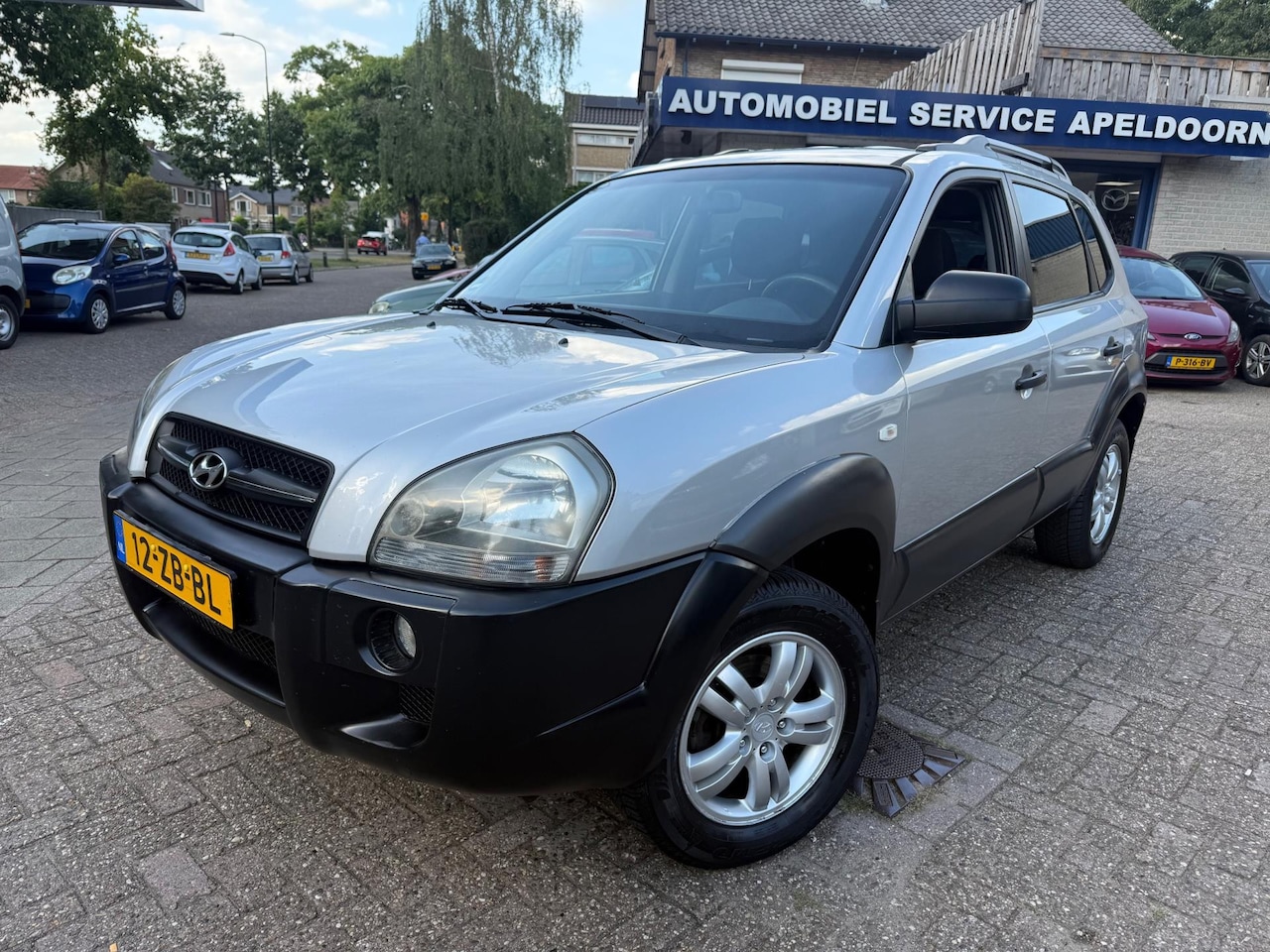 Hyundai Tucson - 2.0i Dynamic Cross *APK*CRUISE*AIRCO*TREKHAAK*LM. VELGEN*ELEKTR. PAKKET* - AutoWereld.nl