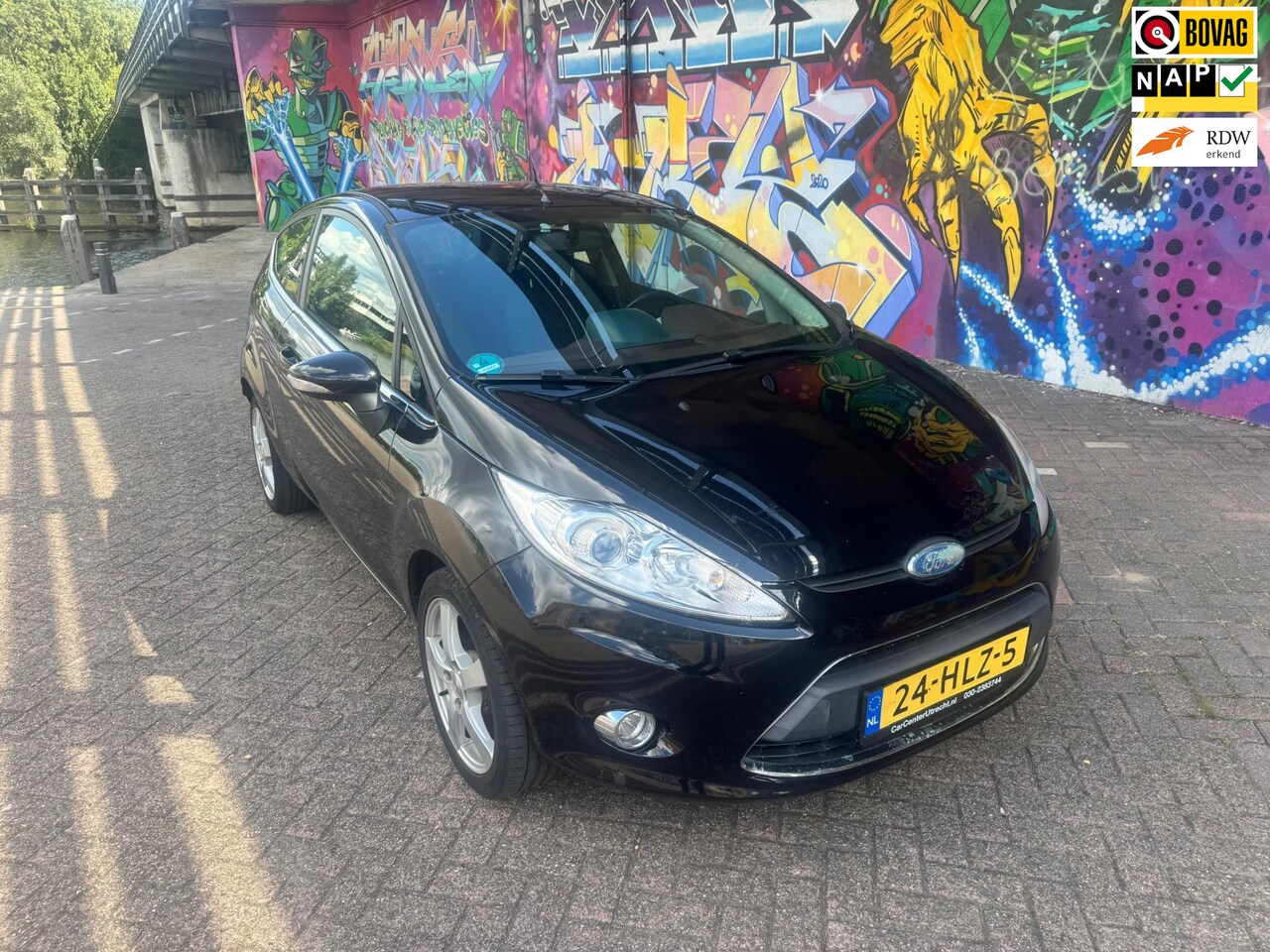 Ford Fiesta - 1.25 Titanium airco navigatie mooie velgen elektrische ramen cv zeer leuke auto - AutoWereld.nl