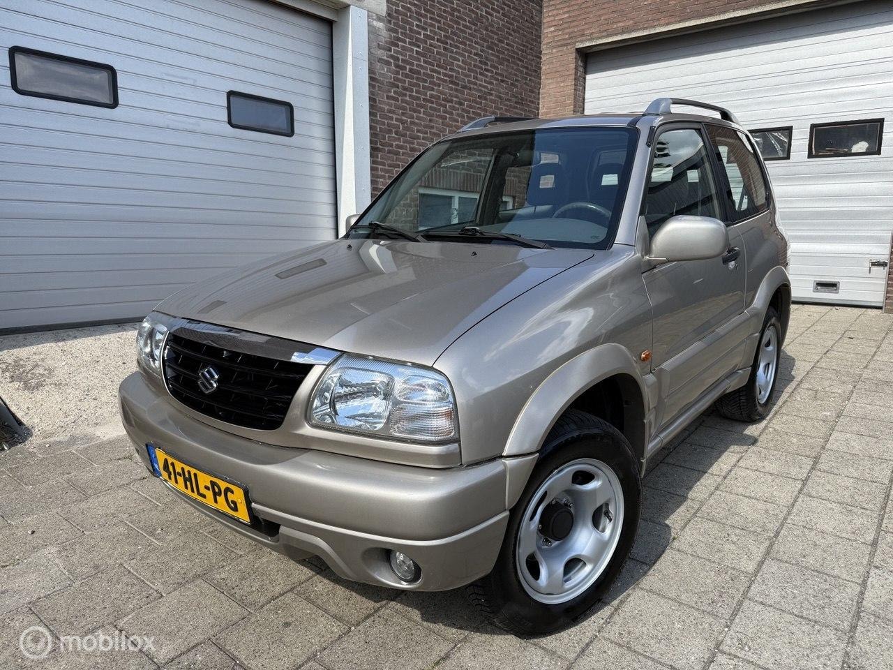 Suzuki Grand Vitara - 1.6 Metal Top Wide Body 1.6 Metal Top Wide Body - AutoWereld.nl