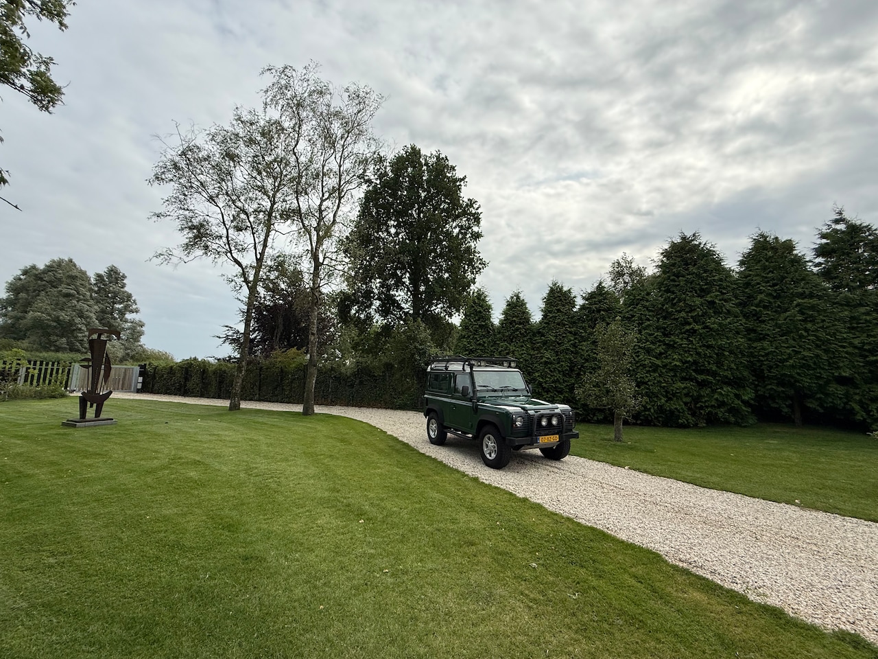 Land Rover Defender - 2.5 TD5 90 SW SE Airco NL auto eerste eigenaar - AutoWereld.nl